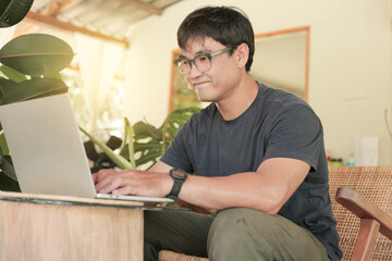 asian man work using computer hand typing laptop keyboard contact us.student study learning education online.adult professional people chatting search at office.concept for technology device business