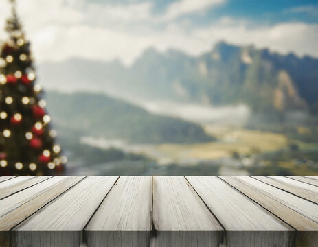 Wooden Terrace the blurred and Christmas background. Wood white table top perspective in front of natural in the sky with light and mountain blur background image for product display