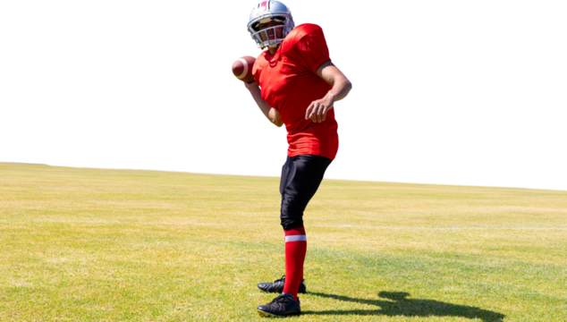 Digital png photo of american football player standing on sports field on transparent background