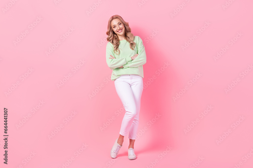 Wall mural full body photo of cheerful successful lovely young lady crossed arms posing isolated on pink color 