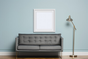 Empty frame mockup in minimal interior with gray couch, modern lamp, blue pastel wall. Copy space.