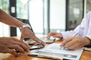 female doctor is reviewing documents to review and diagnose illness and female doctor has...
