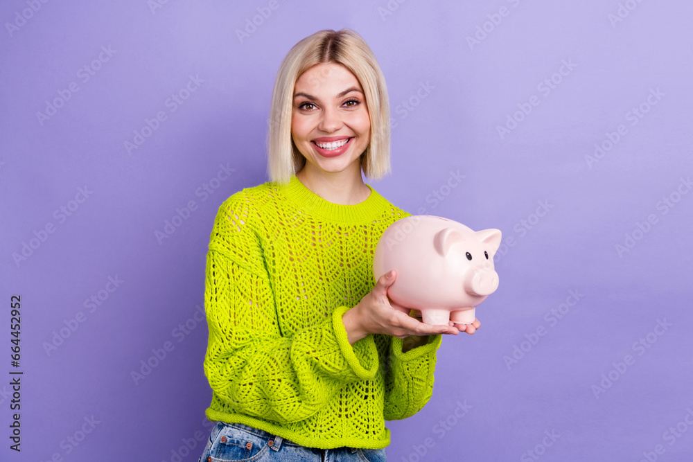 Sticker photo of positive cute woman dressed knitted sweater holding arms pig toy isolated violet color back