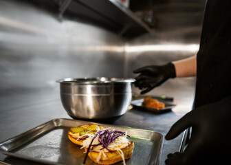 Craft juicy burger with cheese is made by a chef 