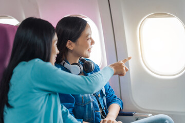 Female airplane passengers traveller asian chinese people airplane allies female friends, side by...