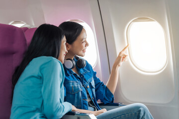 Female airplane passengers traveller asian chinese people airplane allies female friends, side by...