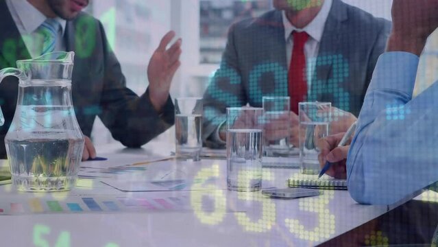 Animation of stock market data processing against mid section of businesspeople discussing together