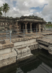 Fototapeta na wymiar Manikeshwar Temple, Lakkundi. India. Trikuta temple with one of the many historical stepwells at Lakkundi