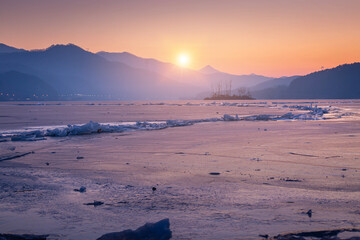Frozen lake in South Korea in winter in sunrise at Dumulmeori, Yangpyeong, South Korea.