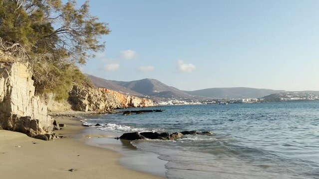 Coast of the sea. Waves hitting the shore at sunset