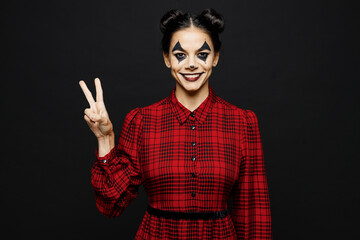 Young smiling cheerful woman with Halloween makeup face art mask wear clown costume red dress show...