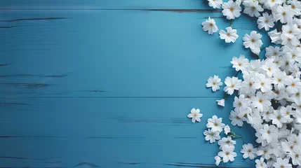 Foto op Canvas Christian cross and border of white daisy flowers on a blue wood background with copy space © HN Works