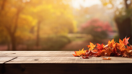 Naklejka na ściany i meble An wooden table with a softened Fall backdrop, including reddish-yellow foliage.