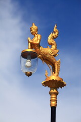 Fototapeta na wymiar Kinaree is the animal in Thai myth. Street light in most important area uses Kinaree as a gold abstract sculpture lamp hanger.