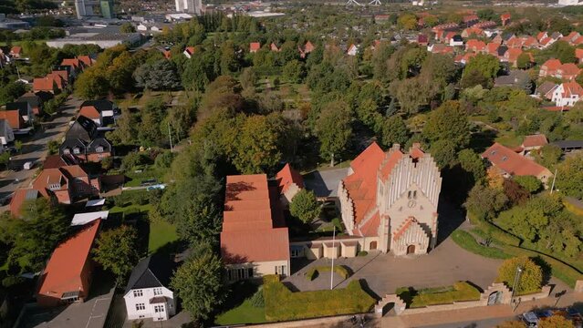 Aerial shot of Fredens church on a sunny day in Odense, Denmark
