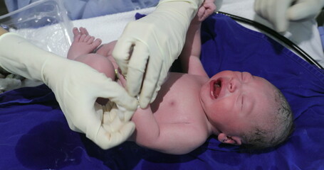 Birth of baby infant crying, first seconds of life