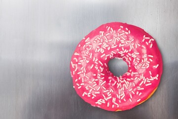 Sweet tasty strawberry pink glazed donut
