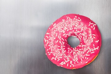 Sweet tasty strawberry pink glazed donut