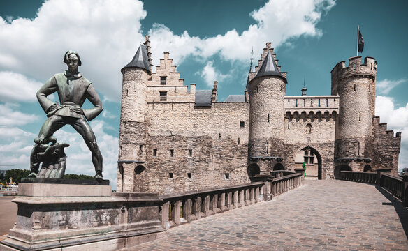 Antwerp, Belgium - July 10, 2023: Statue De Lange Wapper in front of medieval castle Het Steen in  old city center of Antwerp.
