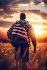 A soldier with a backpack and an American flag on his back stands on a path in a field, Soldier patriot day background, Armistice day, happy veterans day , happy independance day  - obrazy, fototapety, plakaty