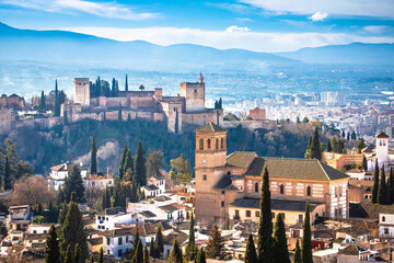 Ancient Alhambra and Sierra Nevada mountain view, UNESCO world heritage site in Granada - obrazy, fototapety, plakaty