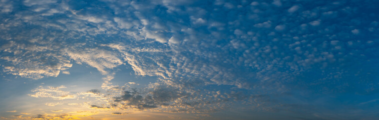 Panorama vivid sky.Panorama of a twilight sunset and colorful clouds - sunlight with dramatic cloud. Evening dusk good weather natural background.