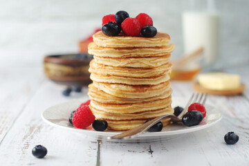 Pancakes with berries in rustic style	