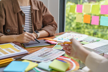 Teamwork brainstorming Creative idea Business project. Business People meeting taking notes while discussing with Color swatch samples to share idea