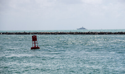 Red buoy on water at Miami Beach