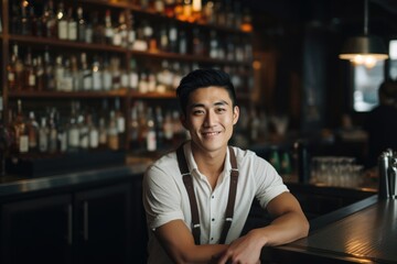 Portrait of a smiling young waiter in a bar