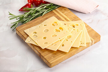 Sliced maasdam cheese with holes