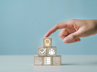 Certificate icon on wooden cube, and quality certification concept, International Organization for...