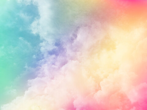 beauty abstract sweet pastel soft orange and green with fluffy clouds on sky. multi color rainbow image. fantasy growing light © Topfotolia