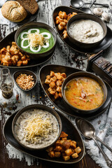Vegetables soup with bacon, Mushroom cream soup and Vegan spinach soup on rustic wooden table. Healthy food, close up