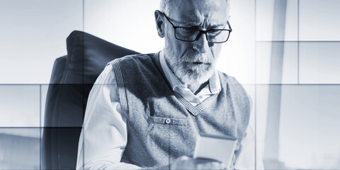 Senior businessman reading a message on his mobile phone, hard light, geometric pattern