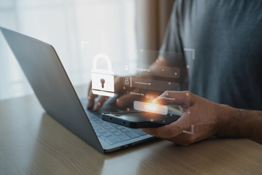 Businessman using mobile phone and laptop to access, information security and encryption, secure access user's personal information, Internet access, cybersecurity. Cyber security technology concept.