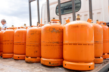 Orange Butane and Propane Cylinders Ready for Delivery - obrazy, fototapety, plakaty