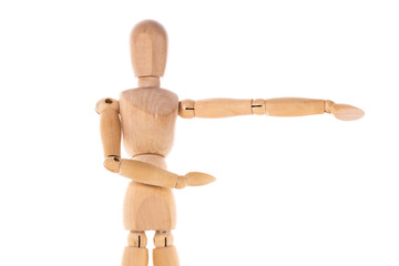 A wooden mannequin pointing at something. This image can be used as a visual representation of direction or guidance.