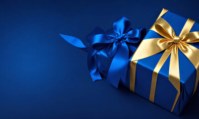 Blue gift box with gold ribbon on a blue background. Blue gift box with gold ribbon on a blue background with space for text.