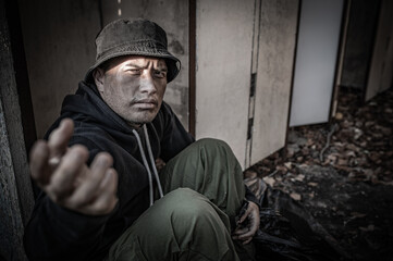 Asian man is homeless at the side road,A stranger has to live on the road alone because he has no...