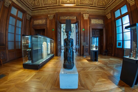 Louvre Museum, Paris, France. The god Amun protecting Tutankhamun. From the temple of Amon-R&ecirc;, Karnak, Egypt. Room 640, Sully wing, Level 1.