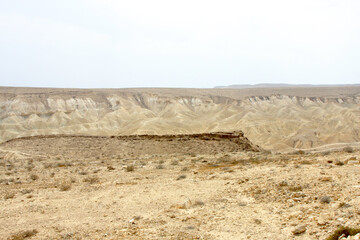 Open Negev Desert in South Israel. Sand dunes with dry air on a summer day.