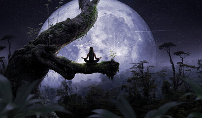 Woman meditating in front of the moon