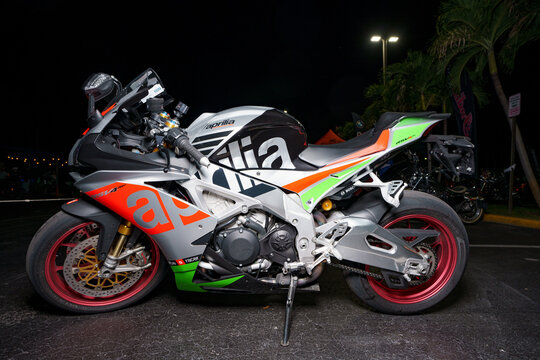 Night flash photo of an Aprilia Italian racing motorcycle