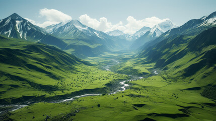 A deep green valley surrounded by snow-capped peaks