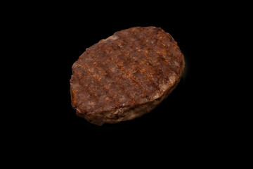 Cutlet with minced beef isolated on  black background.