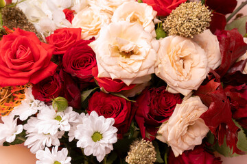 Autumn bouquet of red and white roses, hydrangeas, chrysanthemums as a background.
