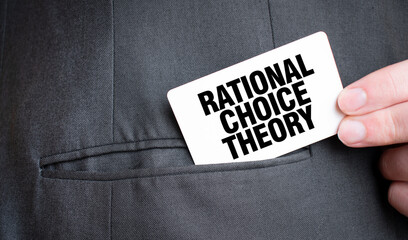 Card with RATIONAL CHOICE THEORY text in pocket of businessman suit. Investment and decisions business concept. - obrazy, fototapety, plakaty