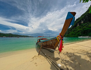 Phi Phi island one of the wonders of beauty just off the coast of phuket thailand. Phi phi island is famous for turquoise clear blue waters teaming with Corel reef fish white soft sand 