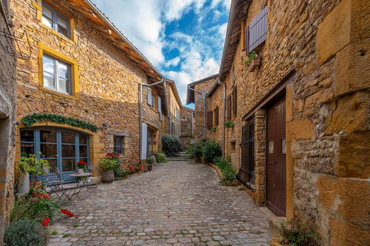Oingt, France - 08 29 2021: City of Oingt. View of a typical street in the village.
